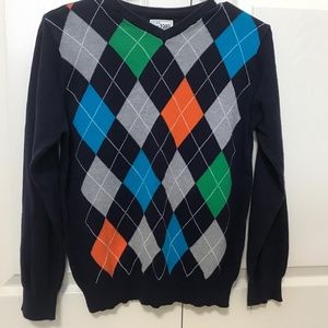 A boy’s sweater size L in good condition